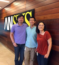 Shaolei Shen poses with other interns in front of ANSYS sign.