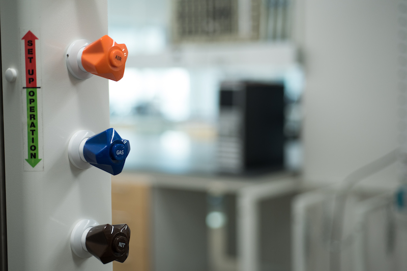 Equipment knobs on a piece of equipment in a lab.