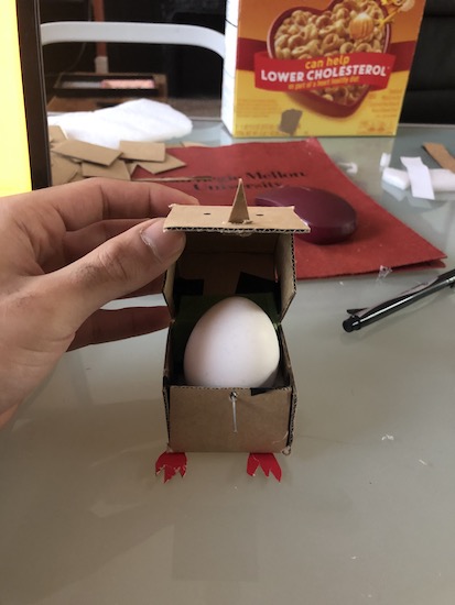 A cardboard egg packaging project that looks like a square chicken