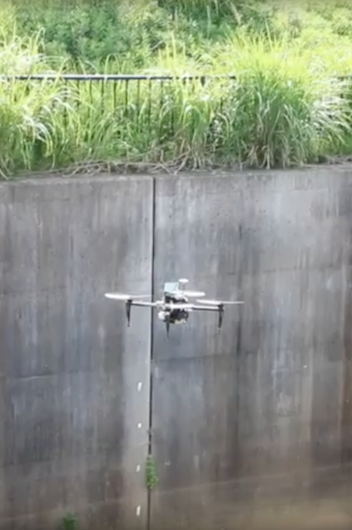 drone flying over water canal